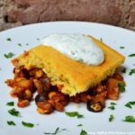 Tamale Pie with Cilantro-Lime Yogurt Sauce ... one of 100 Vegetarian Game Day Recipes! Get ready for the big game with over 100 vegetarian and vegan appetizers, soups, chilis, main dishes, sandwiches, breakfast, desserts, and more that will make your next football watching party unforgettable! | Hello Little Home