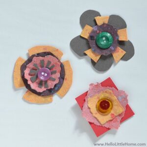 Three of the paper flowers displayed on white paper.