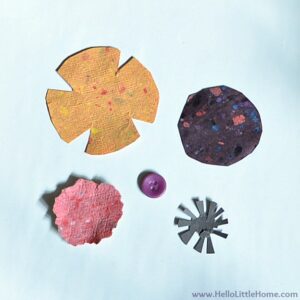 Pieces of paper cut into different shapes to make the flowers.