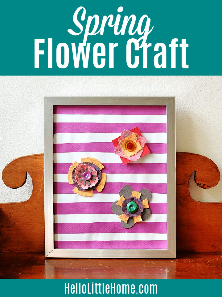 The framed Spring Flower Craft on a wood table.