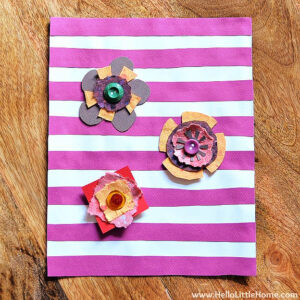 The finished spring flower craft displayed on a wood table.