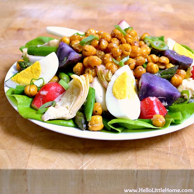 Spring Vegetable Salad with Lemon Basil Vinaigrette and Roasted Chickpeas ... a delicious seasonal recipe! Make this easy vegan salad anytime you're craving a light, healthy meal! It's packed full of veggies and makes a wonderful vegetarian lunch or dinner! | Hello Little Home