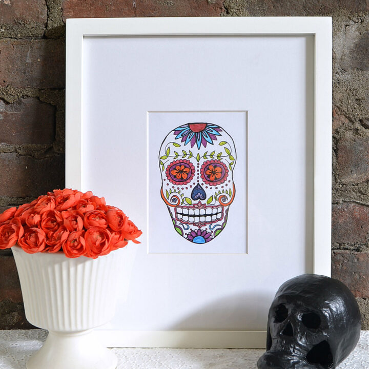 The free Sugar Skull printable displayed in a white frame.