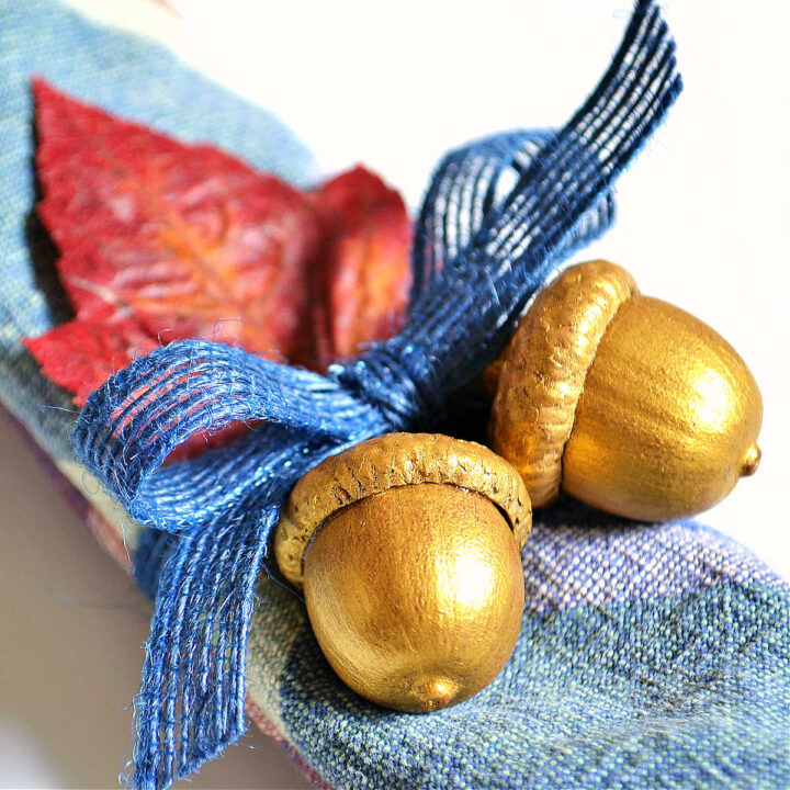 The finished napkin holder tied to a plaid napkin.