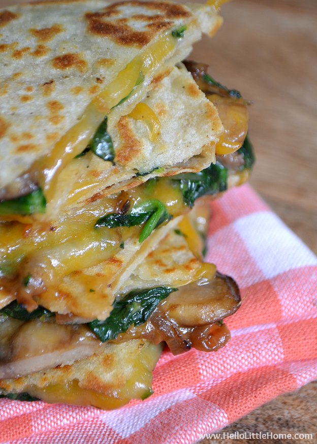 Treat yourself to these Garlicky Mushroom and Spinach Quesadillas! They're the perfect treat for Cinco de Mayo or any occassion! | Hello Little Home #Mexican #Vegetarian #CincodeMayo