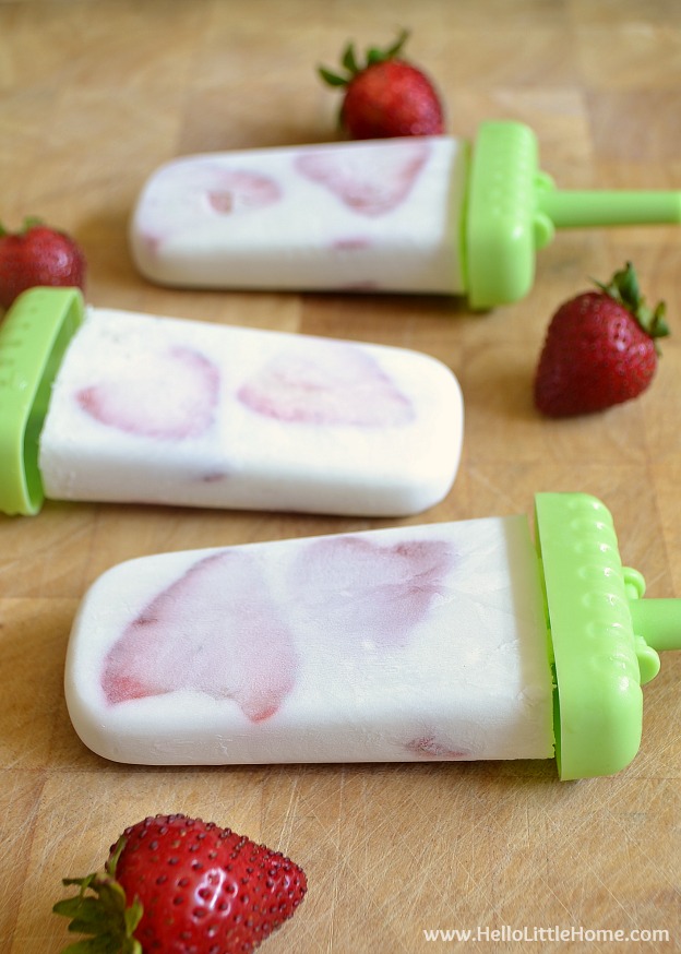 Treat yourself to these Strawberry Coconut Paletas! This Mexican popsicle recipe is creamy, coconutty, and delicious ... plus, so easy to make! You whole family will love these Strawberry Coconut Popsicles! | Hello Little Home #popsicles #paletas #strawberries #coconut #vegan #veganrecipes