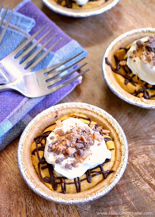 Three Mini Pumpkin Pies on a table with forks and napkins. | Hello Little Home