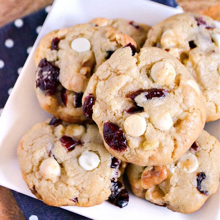White Chocolate Cranberry Cookies on a white plate.
