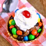 Easy M&M's Sundae recipe ... the perfect way to get your chocolate fix! This easy homemade chocolate sundae is a delicious dessert that's great for summer or any sweet occasion like movie night! Your whole family will love this yummy ice cream sundae recipe! | Hello Little Home