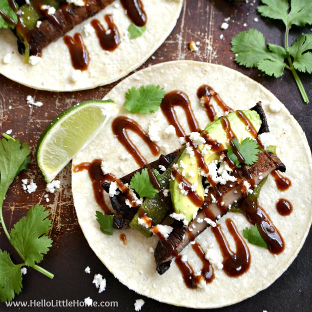 Fire up the grill! These Grilled Portabella Poblano Tacos with Sweet and Spicy BBQ Sauce are perfect for fun and laid back summer entertaining! An easy vegetarian taco recipe, filled with tasty grilled portabella mushrooms, flavorful poblano pepper, and an amazing asian-inspired barbecue sauce that's super easy to make! | Hello Little Home