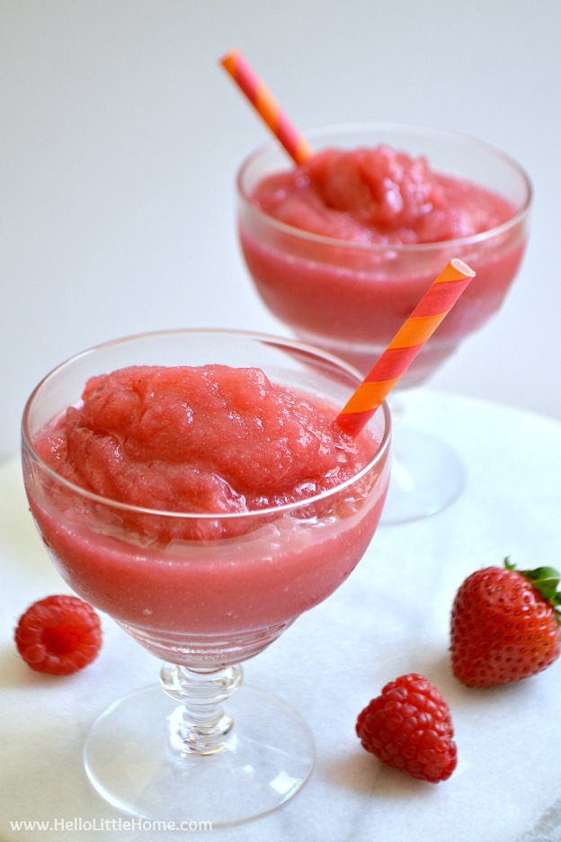 Frosé aka Frozen Strawberry Rosé Slushie ... the perfect summer cocktail recipe! Learn how to make this easy wine slushie recipe from your fave rosé wine, strawberries, and raspberries! This simple homemade frosé recipe comes together quickly in your ice cream maker or freezer. A delicious wine slush that's great for girl's night, birthdays, summer parties, or just because! | Hello Little Home