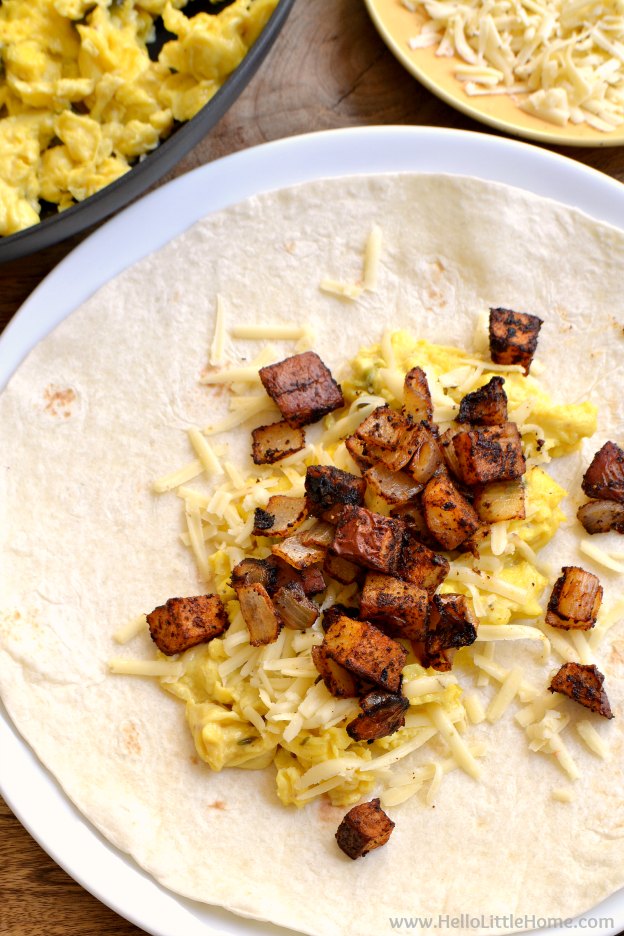 Spicy Egg and Potato Breakfast Burritos ... a delicious vegetarian breakfast recipe that's a great way to start your day! Make this easy recipe as hot or as mild as you prefer. It's the perfect portable morning meal! | Hello Little Home