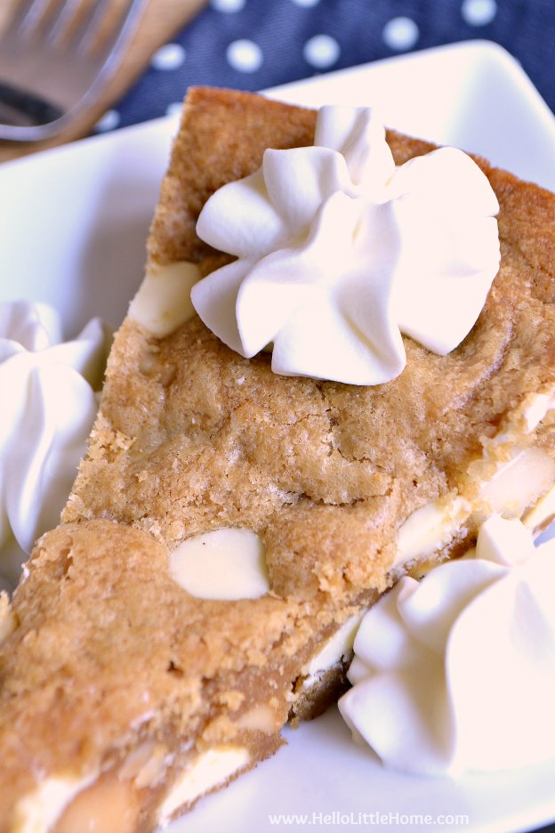 White Chocolate Macadamia Nut Cookie Cake ... the perfect treat for birthday parties or any special occasion! Learn how to make this easy homemade cookie cake recipe that's packed with sweet white chocolate chips and crunchy macadamia nuts. This decadent, oversized cookie pie is sure to become a favorite in your kitchen ... perfect for kids and adults alike! | Hello Little Home