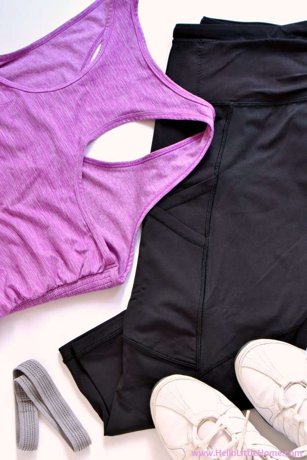 Women's exercise clothes arranged on a white table.