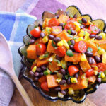 Tex Mex Roasted Sweet Potato Black Bean Salad served in a glass bowl.