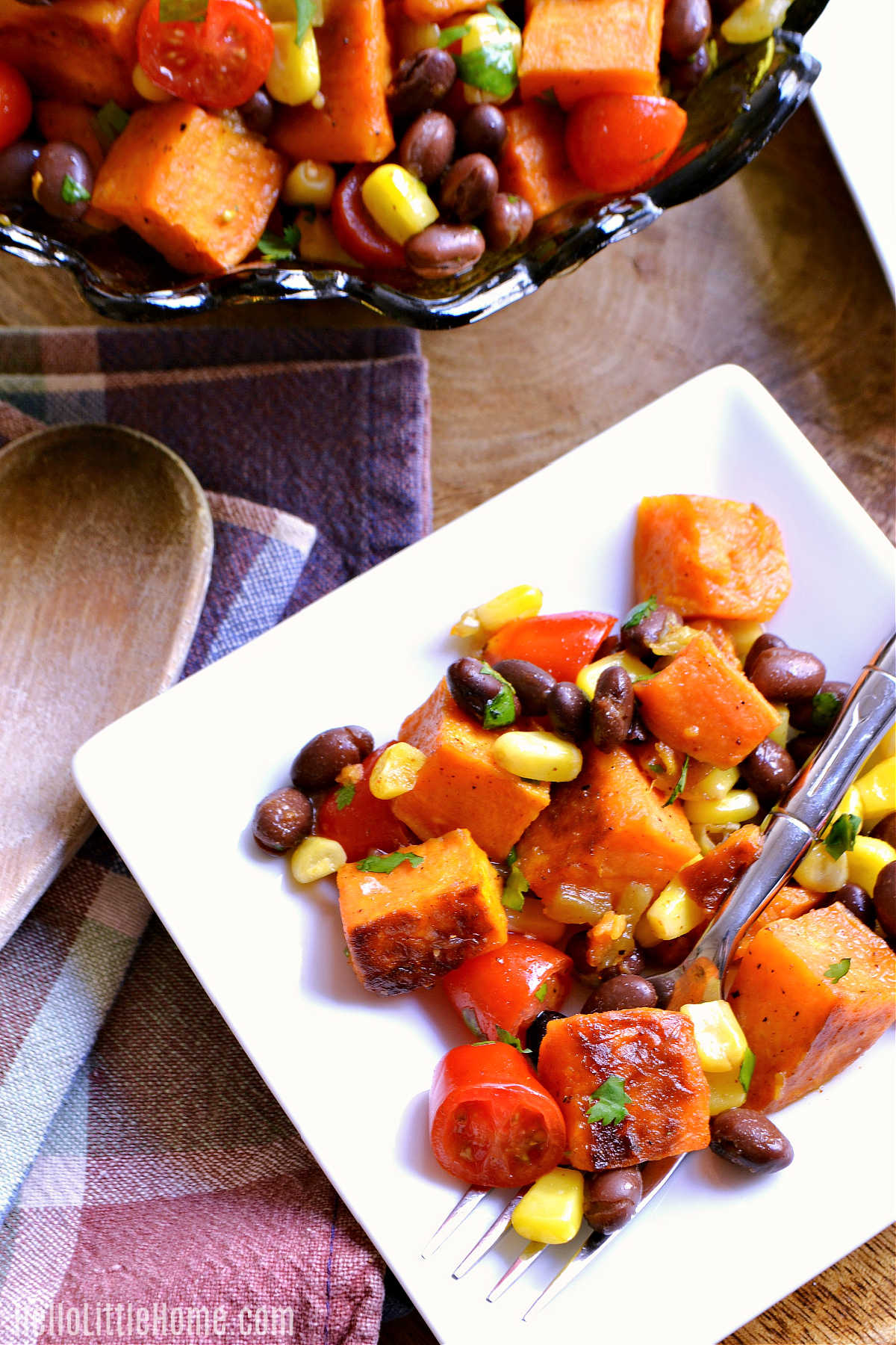 A plate of the finished Tex Mex Salad served next to a plaid napkin.