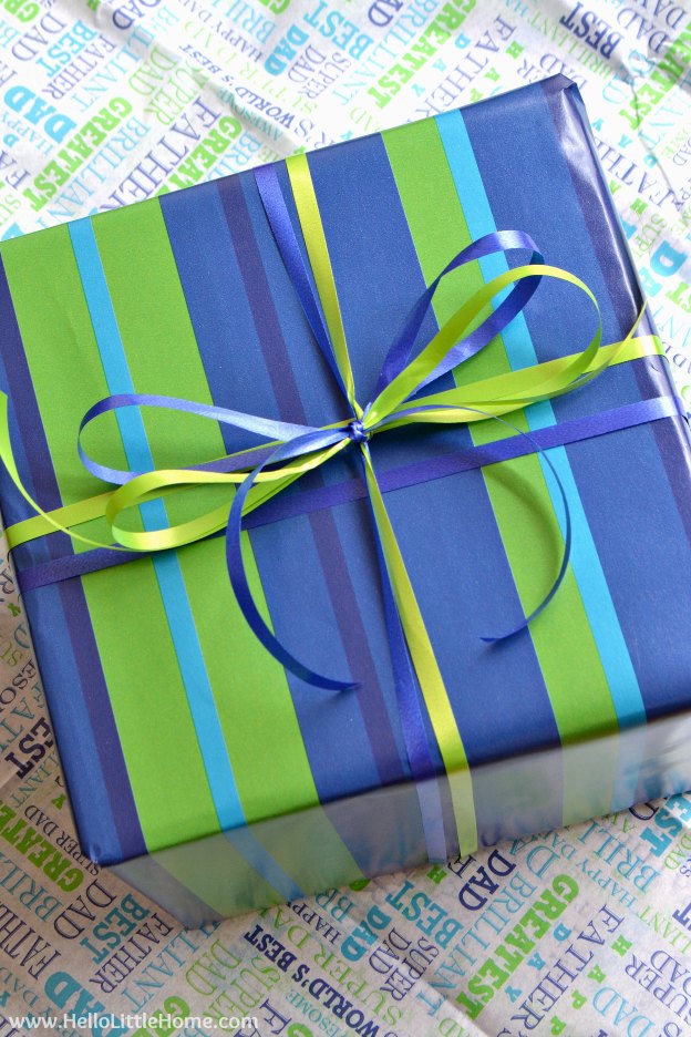 A present wrapped with blue and green striped paper.