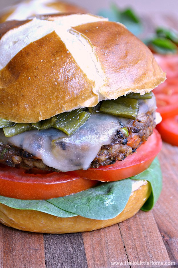 Southwest Black Bean Veggie Burger Recipe! These homemade black bean burgers are easy to make, filled with flavorful, healthy ingredients, and topped with spicy pepper jack cheese and roasted green chilies! Your whole family is going to love this simple vegetarian bean burger recipe! | Hello Little Home