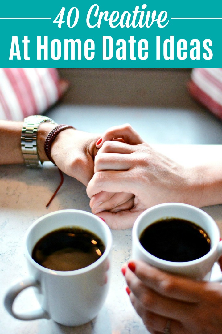 A couple holding hands while drinking coffee.
