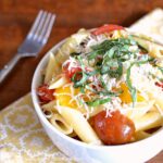 Easy 15 Minute Tomato Basil Pasta recipe! Make this mouthwatering fresh cherry tomato sauce in minutes, then toss it with hot penne and sprinkle with fresh basil and Parmesan cheese (add fresh mozzarella for a Caprese-inspired sauce) ... perfect for weeknight dinners, as well as entertaining. This simple Homemade Tomato Basil Pasta makes a tasty summer meal your whole family with love! | Hello Little Home