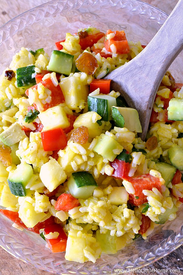 Tropical Rice Salad recipe ... a delicious and easy vegan salad! This healthy cold rice salad is packed with fruits and veggies and features a yummy mango lime vinaigrette. Your whole family will love this summer rice salad recipe! | Hello Little Home