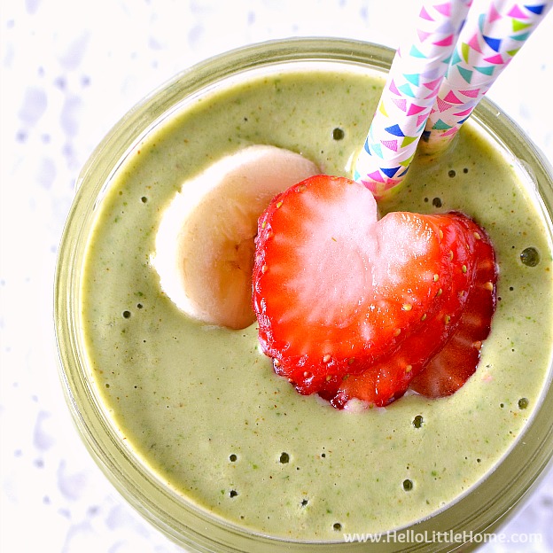 Strawberry Banana Green Smoothie recipe! Learn how to make this delicious, simple green smoothie recipe that's packed with protein and nutritious ingredients, like yogurt, almond butter, spinach, and fresh fruit! This strawberry banana smoothie makes a great healthy breakfast or filling meal replacement! | Hello Little Home