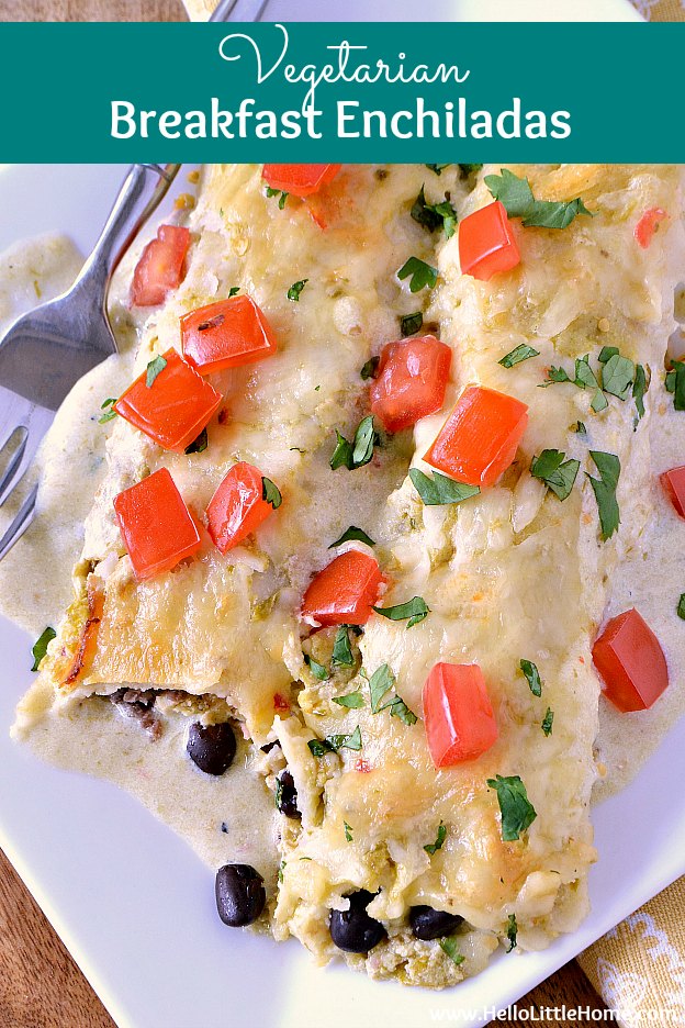 Easy Vegetarian Breakfast Enchiladas recipe ... the perfect meal for breakfast, lunch, or dinner! This delicious Mexican breakfast casserole is packed with yummy ingredients: eggs, black beans, potatoes, and green chiles, wrapped in corn tortillas and baked in a creamy green sauce. So delicious and perfect for a crowd or brunch! | Hello Little Home