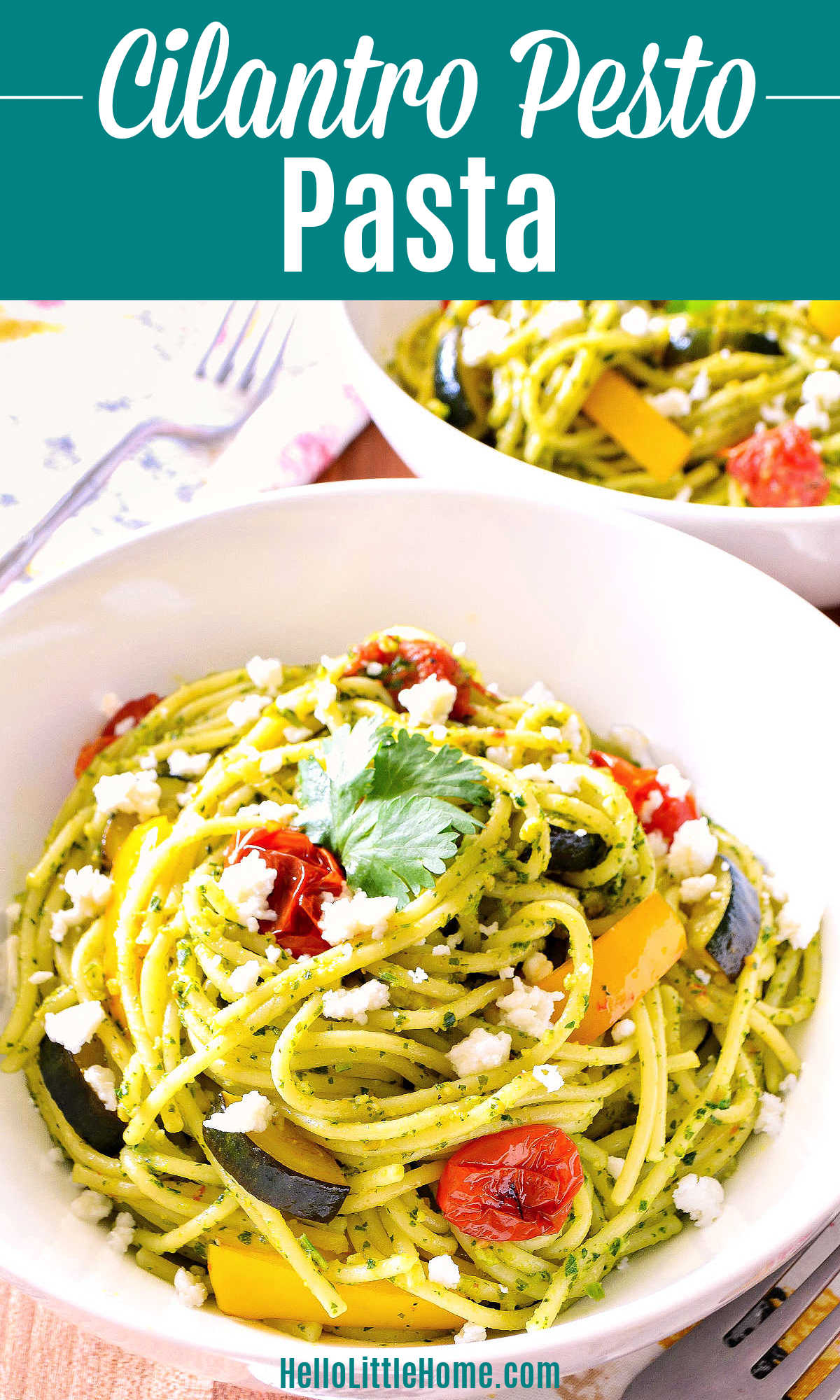 Cilantro Pesto Pasta served in white bowls on a wood table.