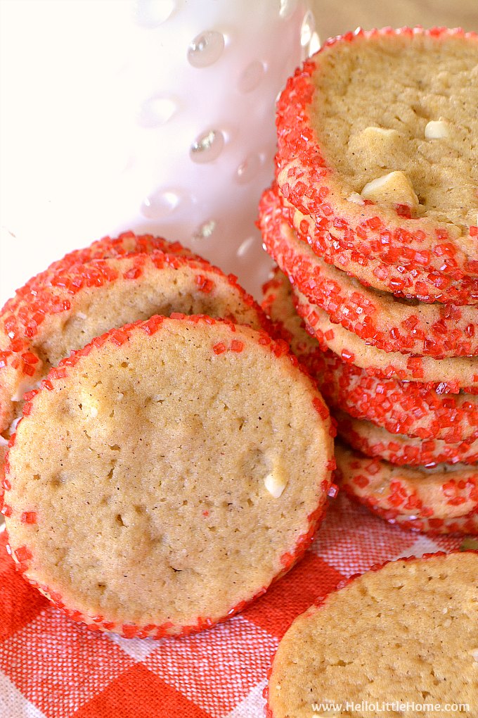 Closeup of the finished cookies with a glass of milk behind them.