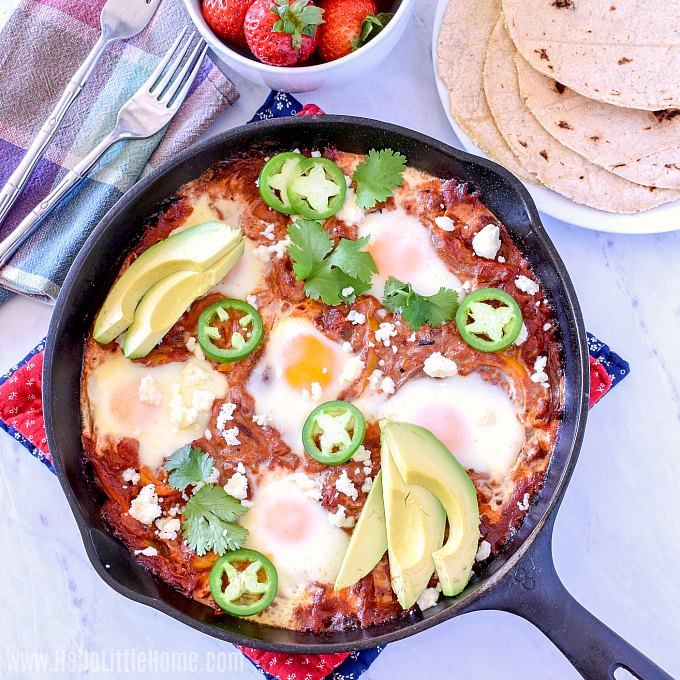 A pan of Mexican Baked Eggs on a marble counter.