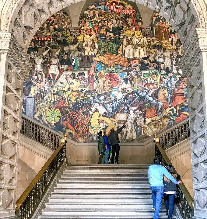 Staircase with massive Diego Rivera Murals at the National Palace Mexico City.