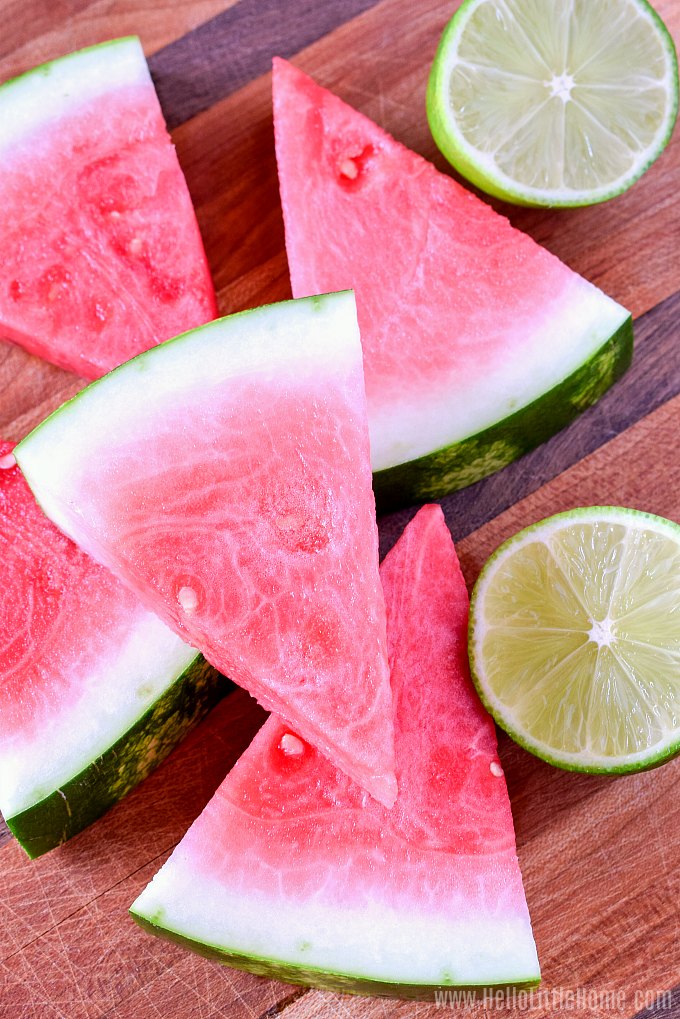 Fresh watermelon juice ingredients on a wood board.
