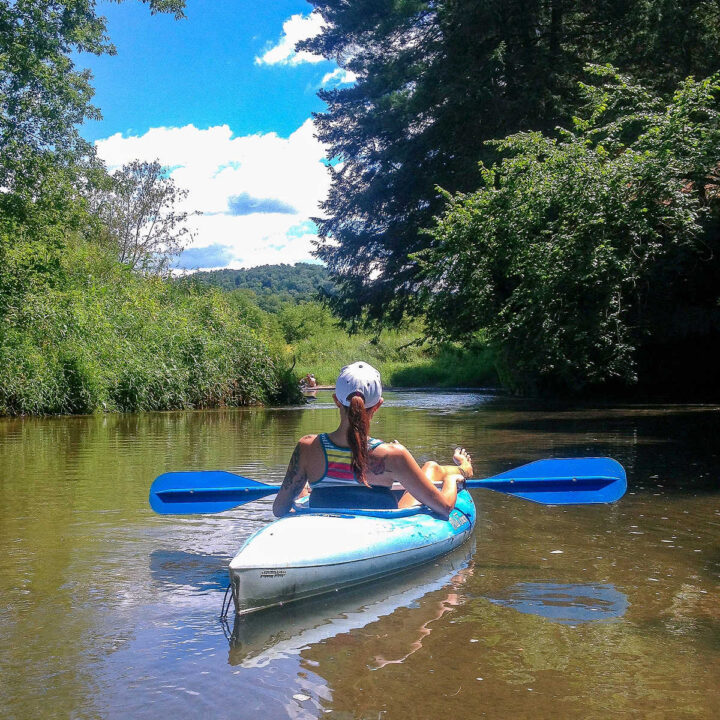 A woman kayaking the Kickapoo River.