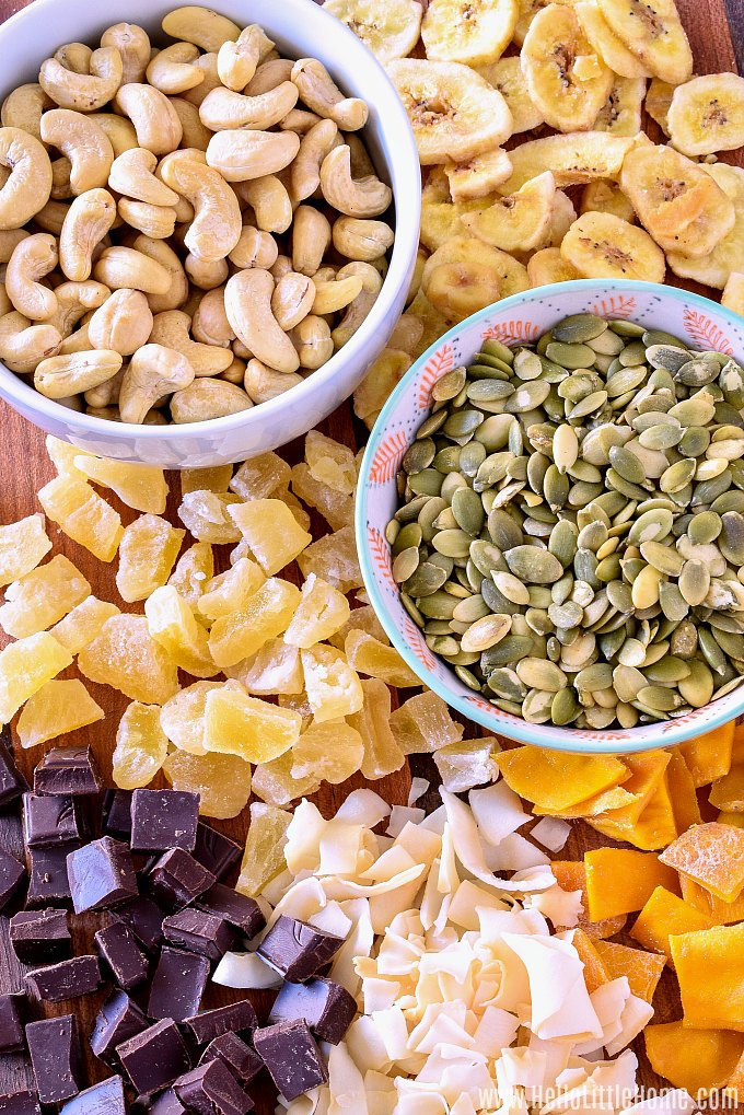 Trail Mix Ingredients: cashews, pumpkin seeds, dried fruit (pineapple, mango, banana), dark chocolate, coconut chips.