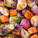 Roasted vegetables on a baking pan.