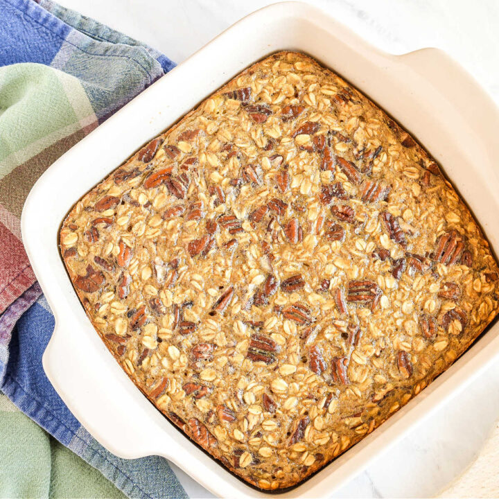 A pan of Baked Oatmeal served next to a plaid napkin.