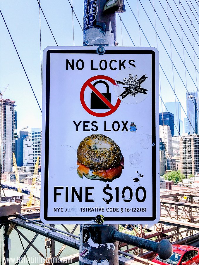 A "No Locks, Yes Lox" sign on the Brooklyn Bridge.