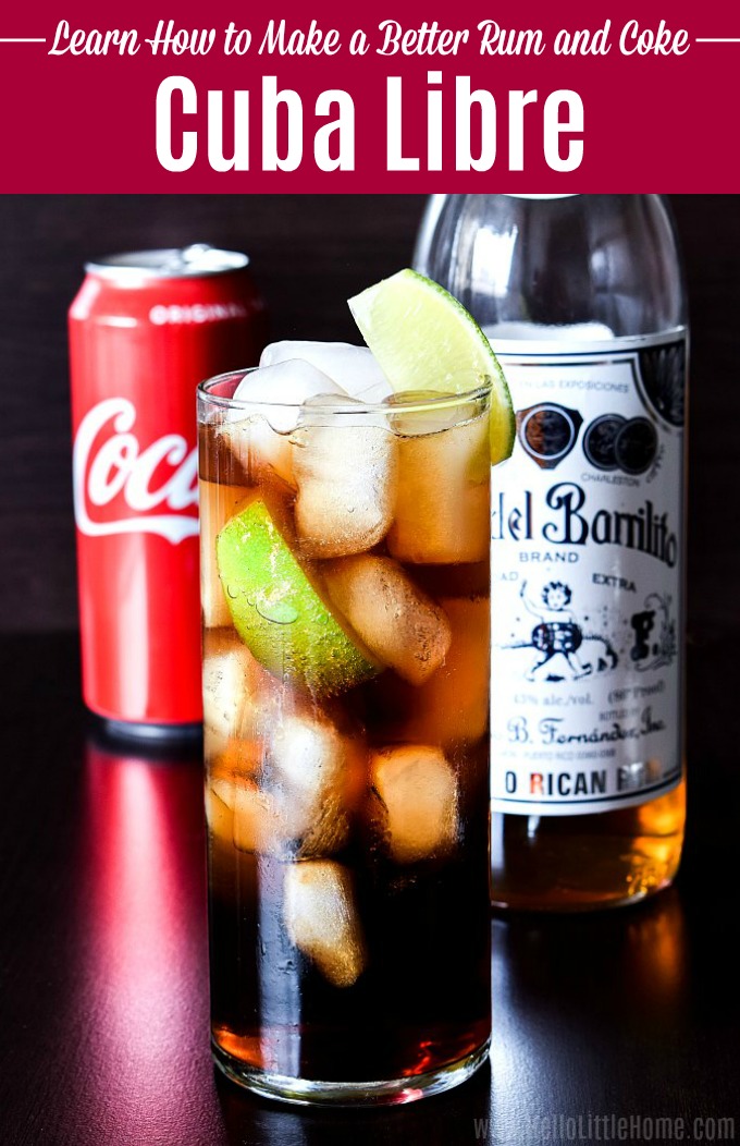 A Cuba Libre cocktail garnished with lime.