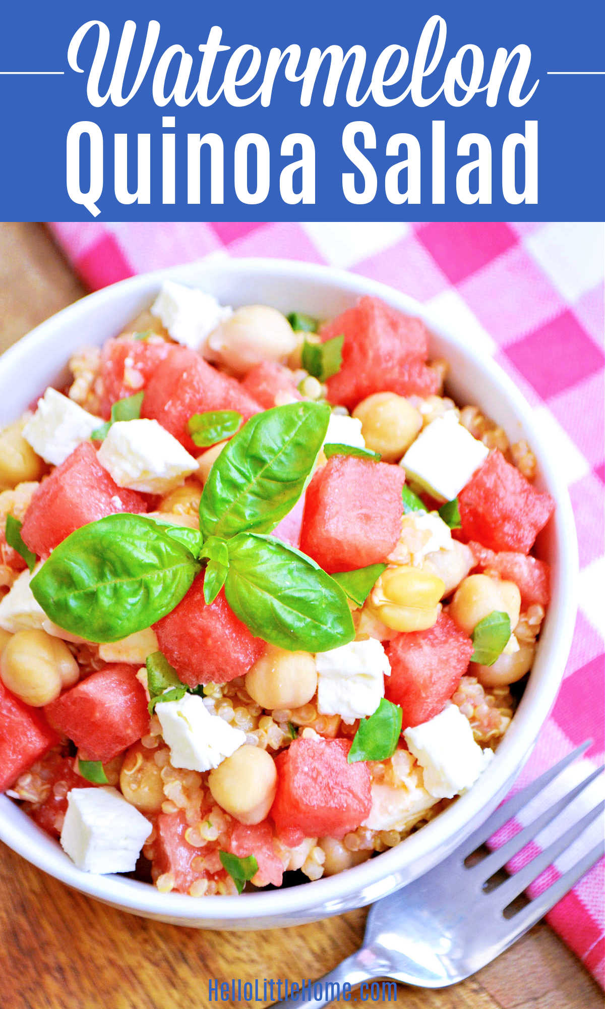 A bowl of Watermelon Quinoa Salad next to a checked napkin and fork.