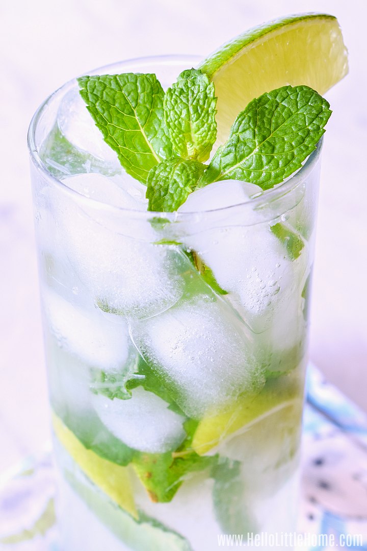 Closeup of the finished drink garnished with mint and a lime wedge.