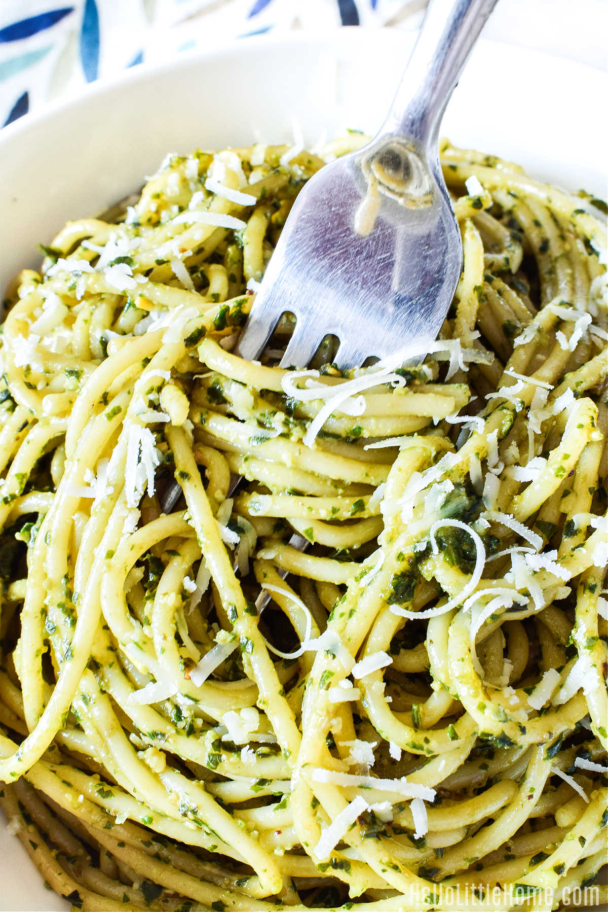 A fork twirling strands the finished pasta.