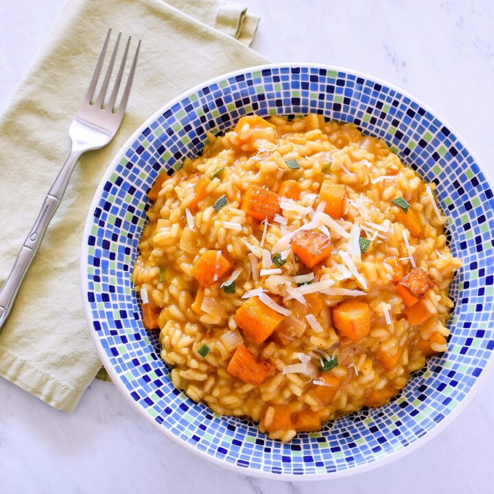 A blue bowl filled with Pumpkin Risotto.