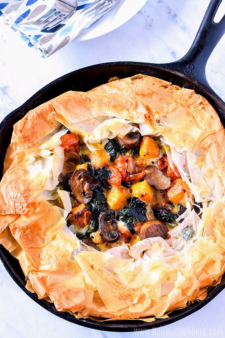A Skillet Veggie Pie with Phyllo Crust filled with kale, mushrooms, tomatoes, and butternut squash.