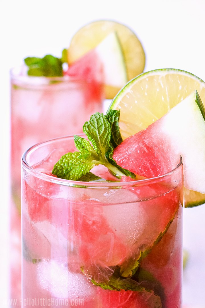 A closeup of the finished drink topped with a watermelon wedge and lime slice.