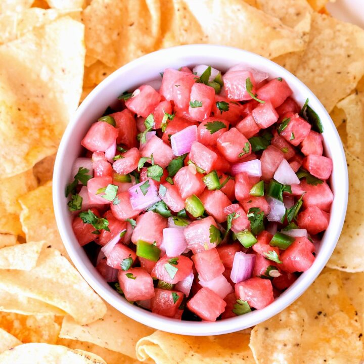 Watermelon Salsa in a bowl surrounded by chips.