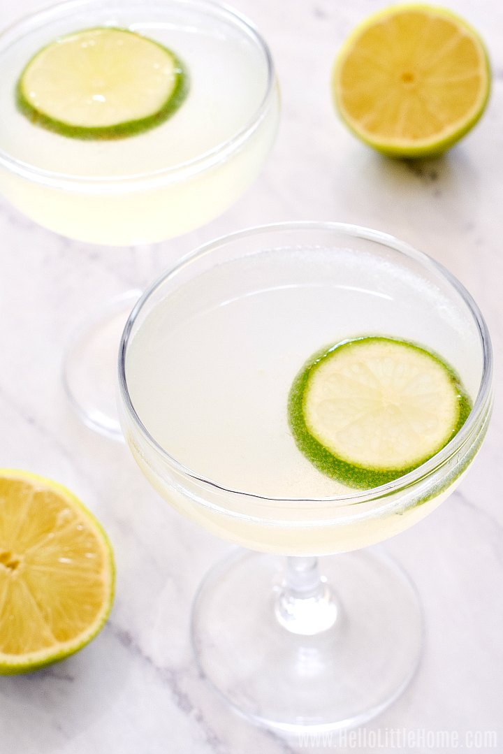 Closeup of two of the finished drinks garnished with lime slices.