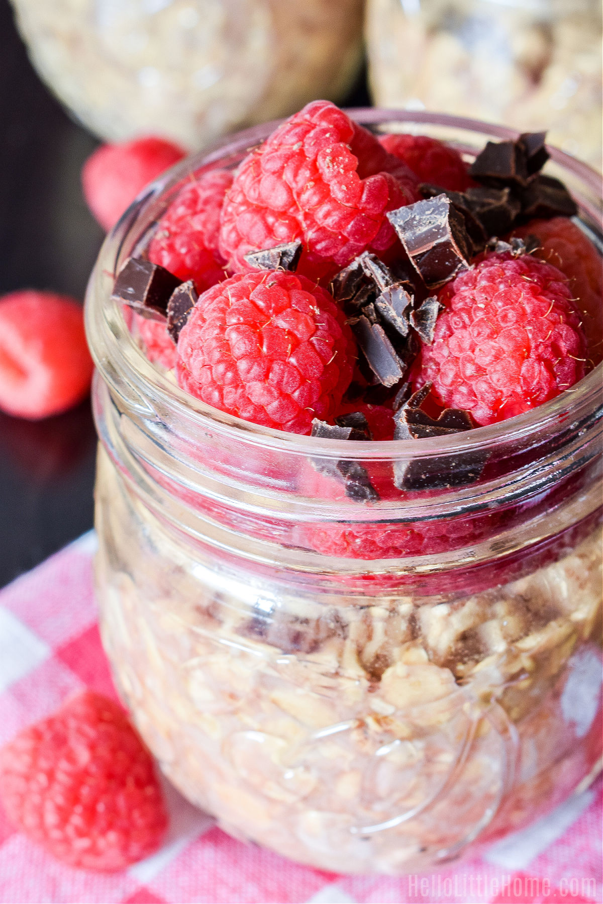 Closeup of the finished oats topped with fresh berries and chocolate chunks.