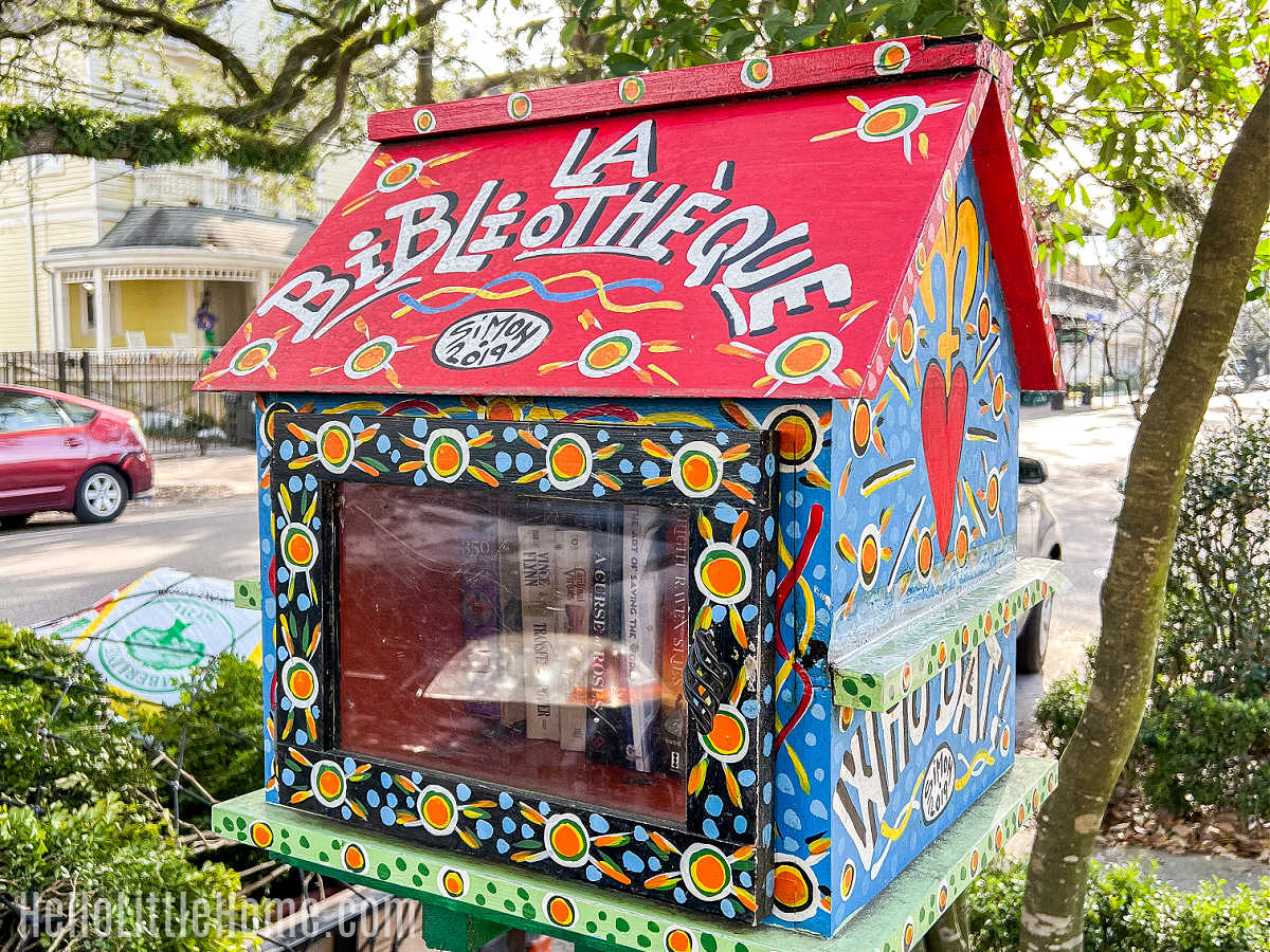 A colorful Little Free Library located on Magazine Street in the Garden District.