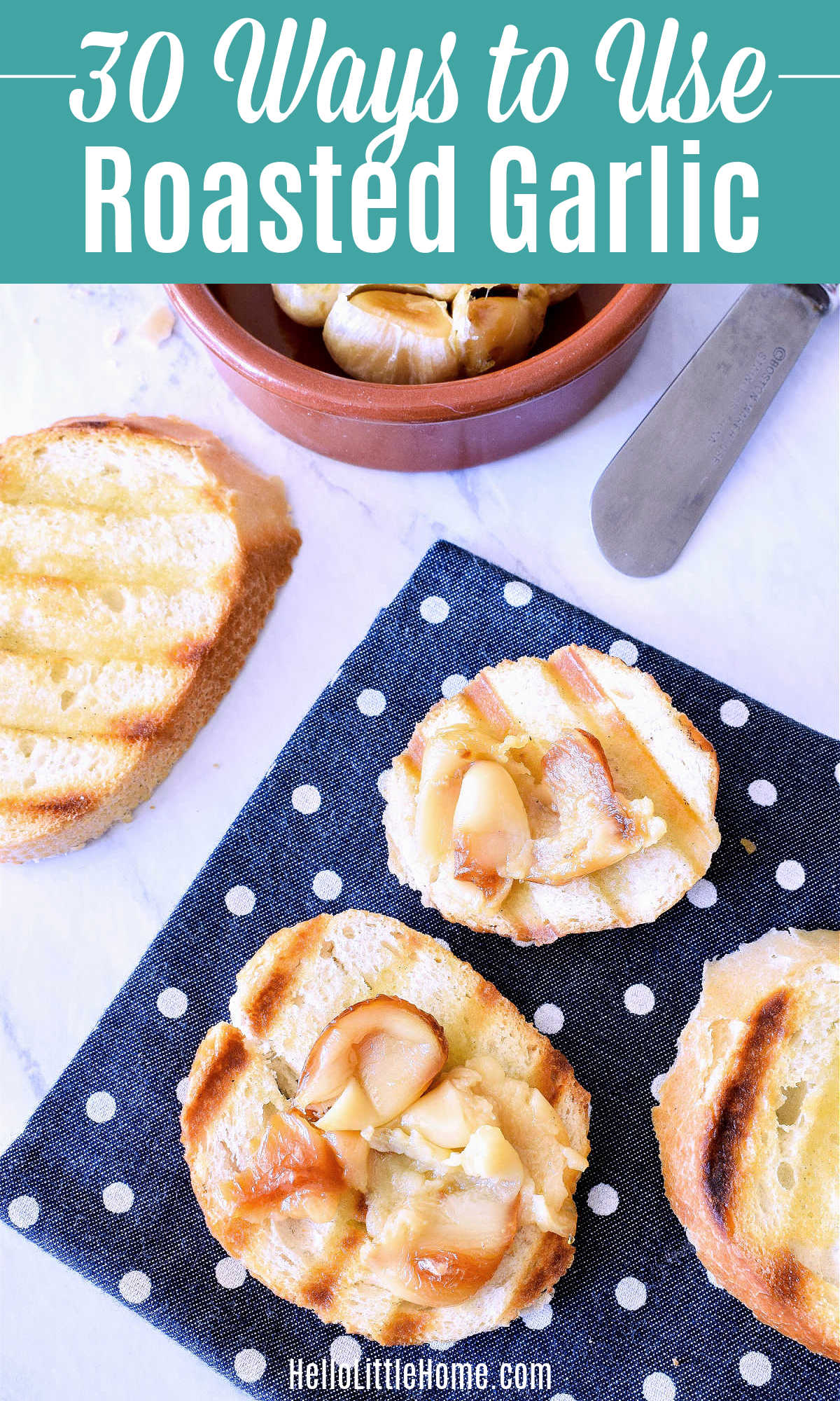 Bread slices spread with roasted garlic on a polka dot napkin.