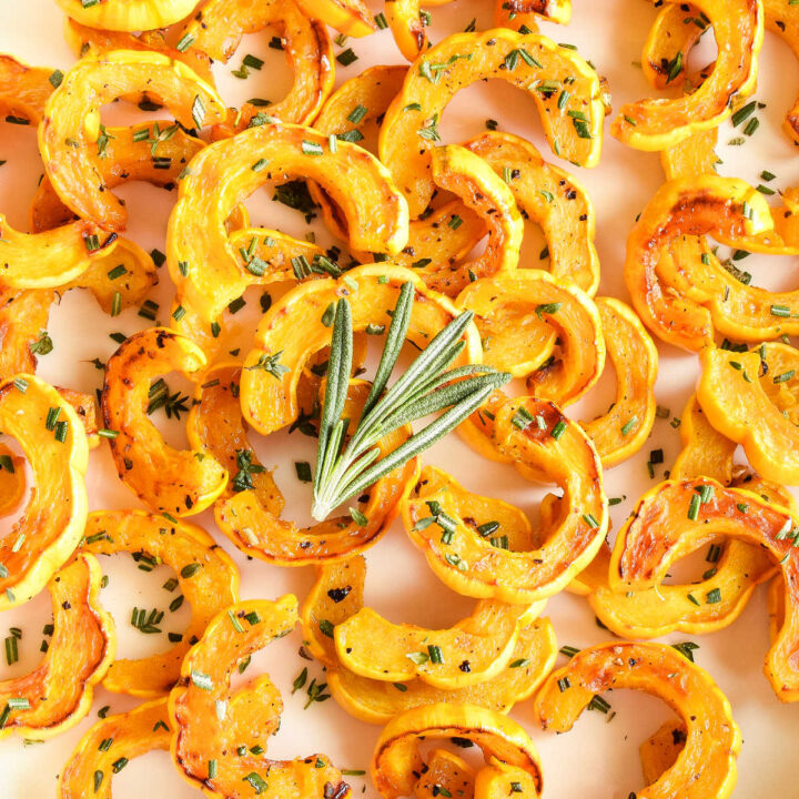 A white tray topped with Roasted Delicata Squash.